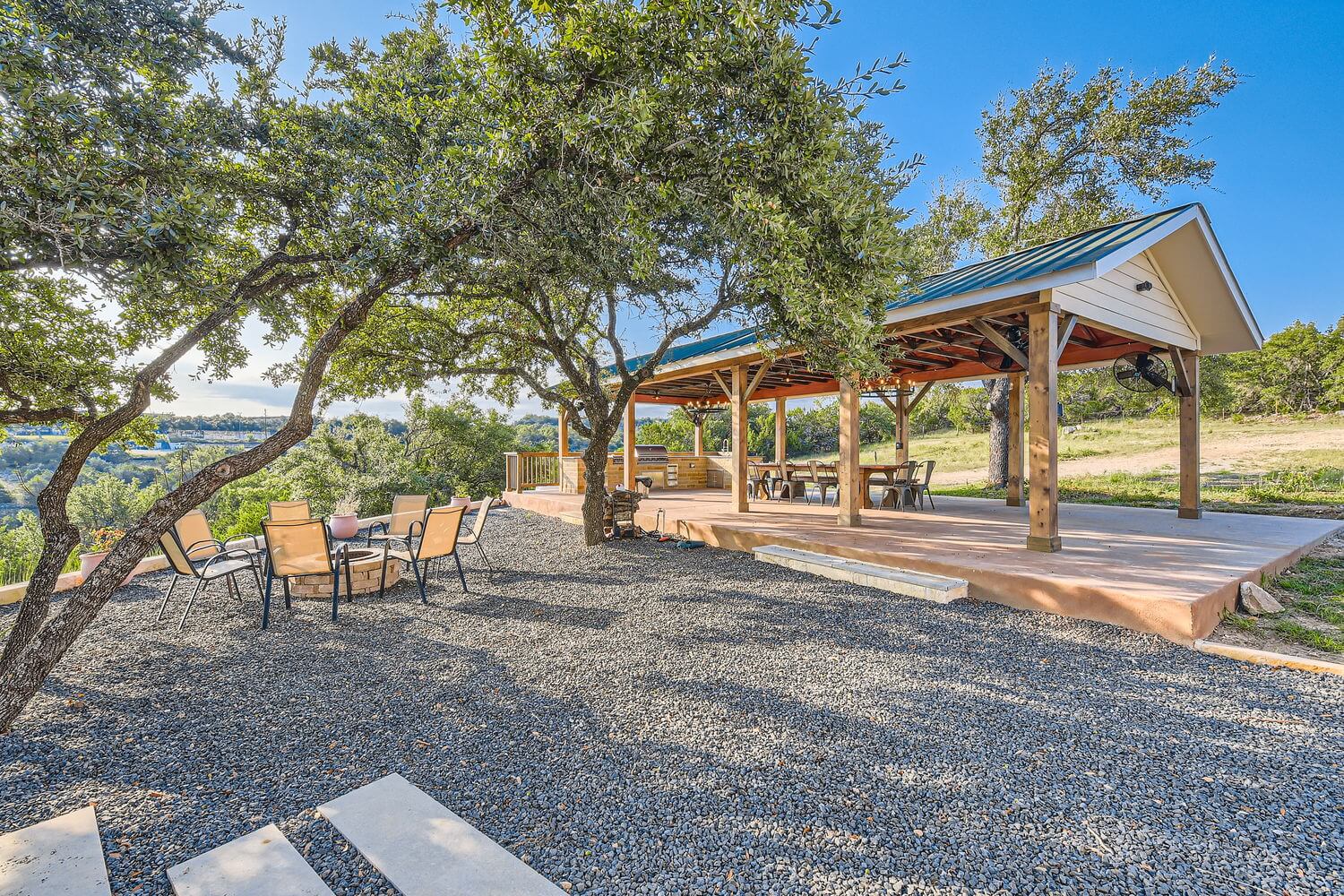 Hilltop Hideaway’s Outdoor Pavilion — Perfect for Rehearsal Dinners & Welcome Parties

Celebrate in style at our 1,200 sq ft Covered Outdoor Pavilion, an inviting open-air venue nestled on a private ridge with panoramic Hill Country views. This beautifully designed space is ideal for rehearsal dinners, welcome parties, or relaxed outdoor receptions and features:
	•	A fully equipped outdoor kitchen with a built-in BBQ grill, ideal for catering or grilling
	•	A spacious dining area with comfortable seating under a vaulted roof with ceiling fans for comfort
	•	A shaded gravel courtyard with mature oak trees, a cozy fire pit, and lounge-style seating — perfect for mingling and late-night conversations
	•	Breathtaking Hill Country vistas as your backdrop, creating an unforgettable ambiance as the sun sets behind the rolling hills

Whether you’re kicking off your wedding weekend or gathering for an intimate celebration, this pavilion offers the perfect blend of Texas charm, functionality, and natural beauty.