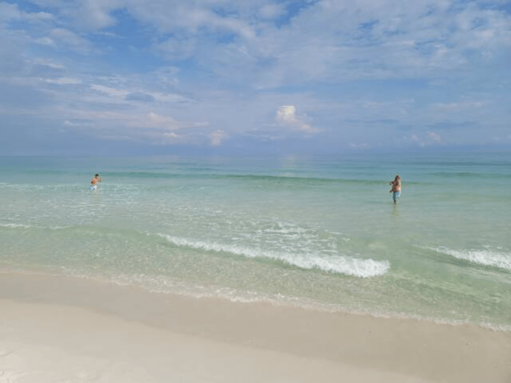 A stop on Gulf National Seashore just a few minutes from Pensacola Beach! Opal Beach is relaxing and private. You'll find no hotels or highrises. Just natural Gulf beauty. The boys out here playing catch with the football.